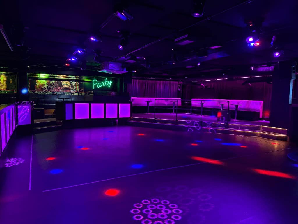 Nightclub dance floor with purple lights